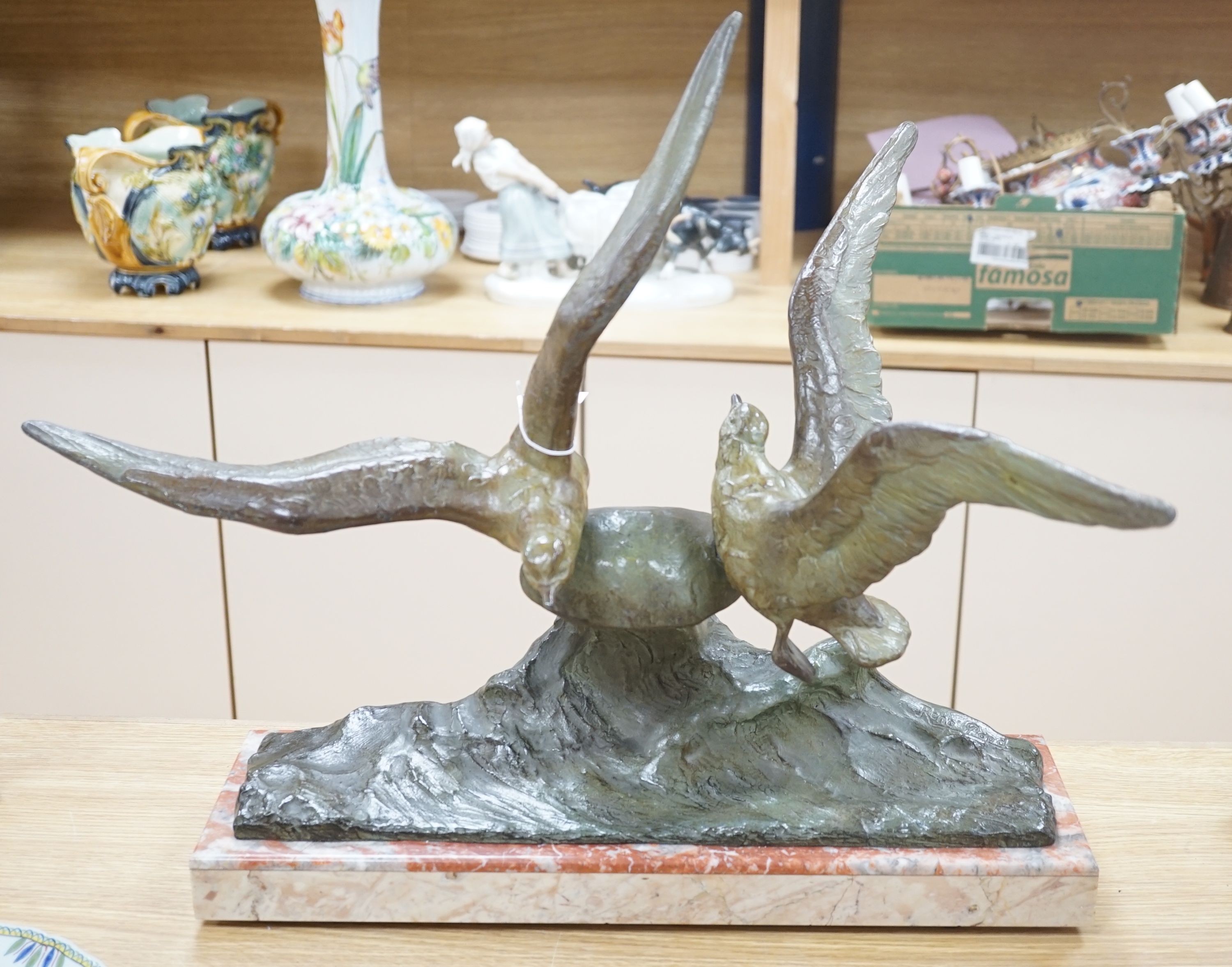 An Art Deco bronzed metal gull and wave group on marble base, signed Rene Papa, 52cm